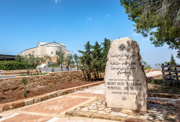 The Memorial of Moses and the Moses Memorial Church on Mt Nebo, Jordan. The Memorial of Moses on top of Mt Nebo, in Jordan, with the Moses Memorial Church in the background. mount nebo jordan stock pictures, royalty-free photos & images