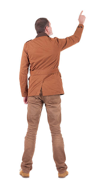 istock Back view of man in jacket pointing 157109105