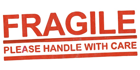 fragile please handle with care sign isolated over white background