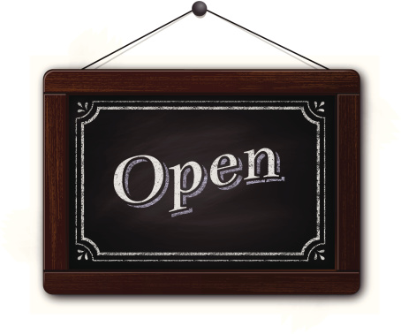 Vector Illustration of an Open Sign on a chalkboard. The sign is hanging by string on a nail. Open is written in classic serif typography and is surrounded by a decorative border. Some transparency has been used. Document color mode is RGB. AI file is also included. Green color version included as EPS 10 and AI and jpeg files