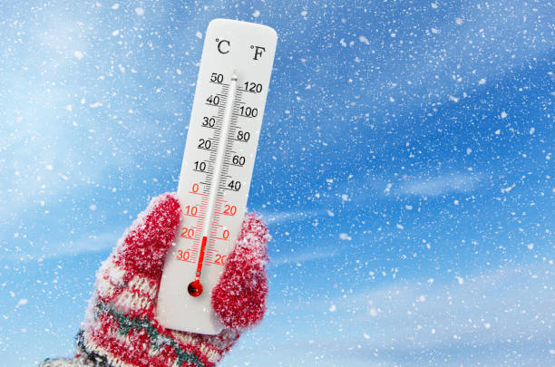 istock White celsius and fahrenheit scale thermometer in hand. Ambient temperature minus 18 degrees celsius 1571137077