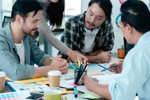 istock Creative design office center working teamwork. Happy business people partner plan strategy organization research people together at diversity office using laptop, smartphone company conference room 1571139296