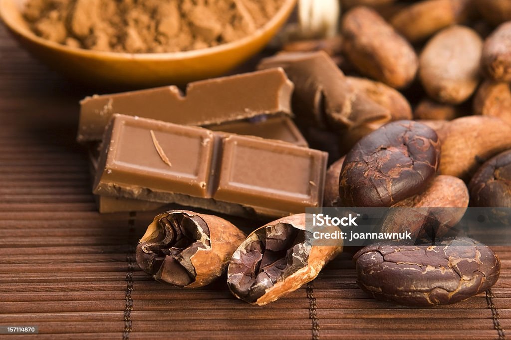 Cocoa ( cacao ) beans on natural wooden table Bean Stock Photo