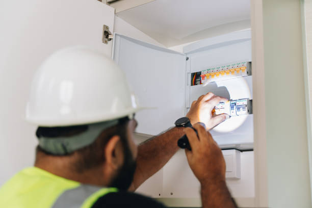 istock Electrician checking on the electric circuit board 1571179868