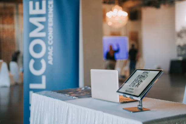 istock APAC registration counter with digital tablet display QR code for self check in at hotel business conference entrance hall 1571181928