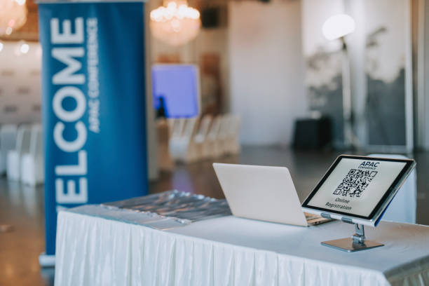 istock APAC registration counter with digital tablet display QR code for self check in at hotel business conference entrance hall 1571182439