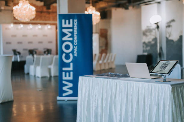 istock APAC registration counter with digital tablet display QR code for self check in at hotel business conference entrance hall 1571182458