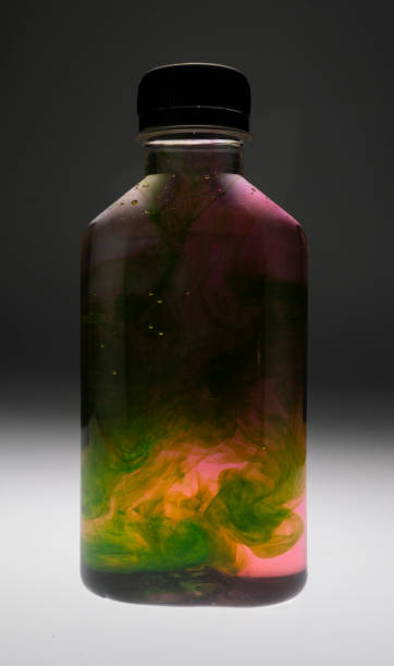 istock Plastic bottle containers with food colouring mixing creating unique textures and patterns 1571262468