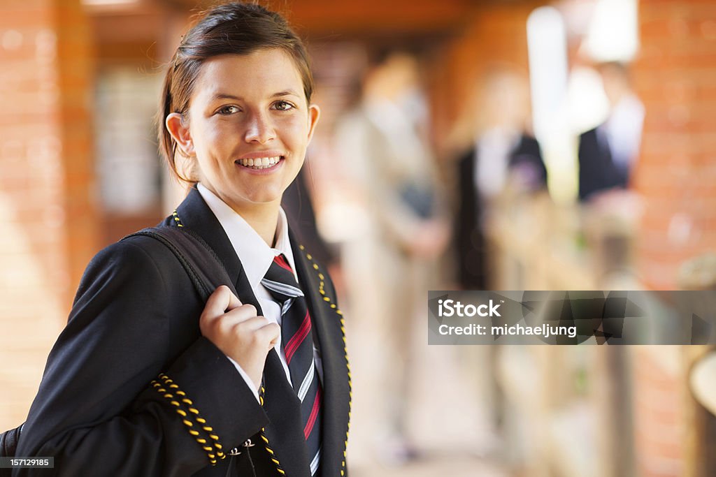 A high school female in blazer and striped tie cute female high school student portrait High School Student Stock Photo