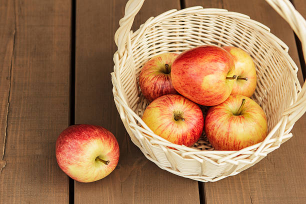 istock Beautiful and ripe apples in wattled basket 157129206