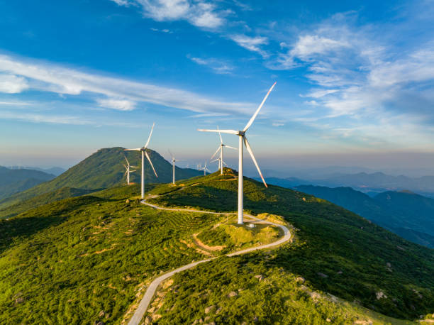 istock Wind farm on the mountain, blue sky and white clouds 1571293377