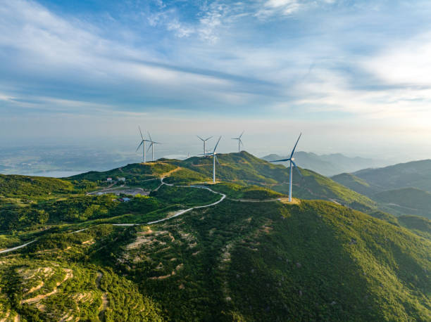istock Wind farm on the mountain, blue sky and white clouds 1571293416