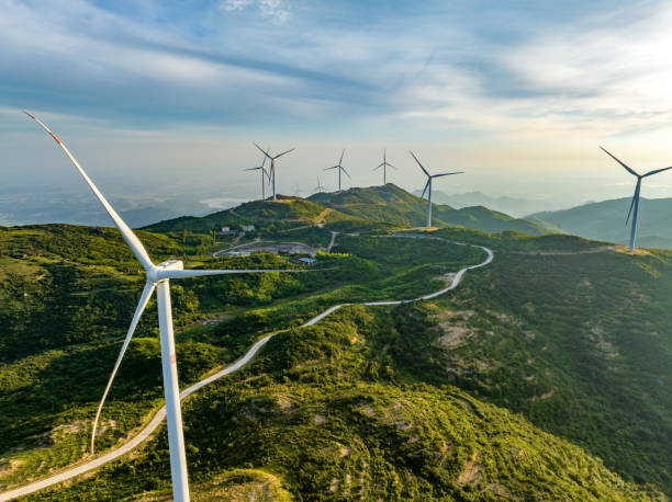 istock Wind farm on the mountain, blue sky and white clouds 1571293951