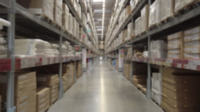 4K blur walking point of view . Warehouse