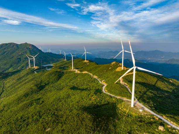 istock Wind farm on the mountain, blue sky and white clouds 1571294979