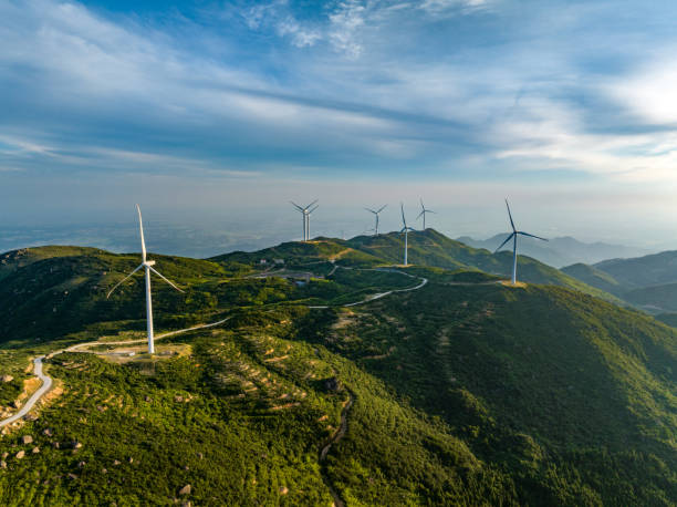 istock Wind farm on the mountain, blue sky and white clouds 1571294982