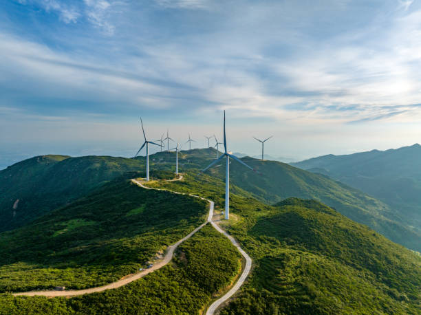 istock Wind farm on the mountain, blue sky and white clouds 1571296029
