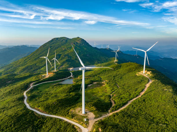 istock Wind farm on the mountain, blue sky and white clouds 1571297088