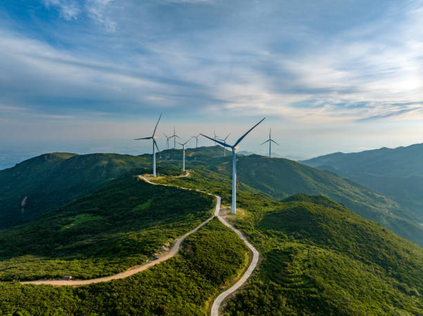 istock Wind farm on the mountain, blue sky and white clouds 1571297089