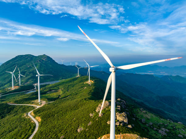 istock Wind farm on the mountain, blue sky and white clouds 1571298171