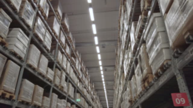 4K Blur walking point of view . Warehouse