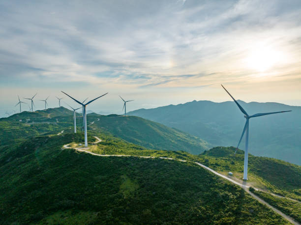 istock Wind farm on the mountain, blue sky and white clouds 1571299836