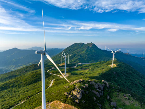 istock Wind farm on the mountain, blue sky and white clouds 1571300361