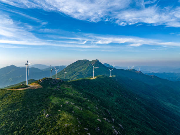 istock Wind farm on the mountain, blue sky and white clouds 1571304634