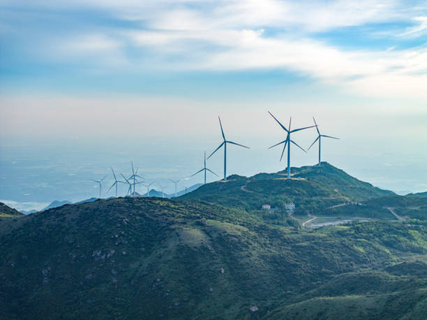 istock Wind farm on the mountain, blue sky and white clouds 1571312662