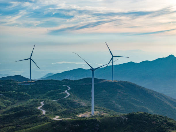 istock Wind farm on the mountain, blue sky and white clouds 1571313182