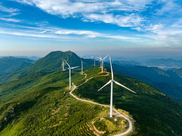istock Wind farm on the mountain, blue sky and white clouds 1571313190
