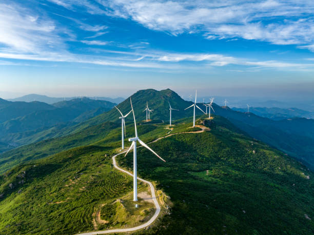 istock Wind farm on the mountain, blue sky and white clouds 1571314806