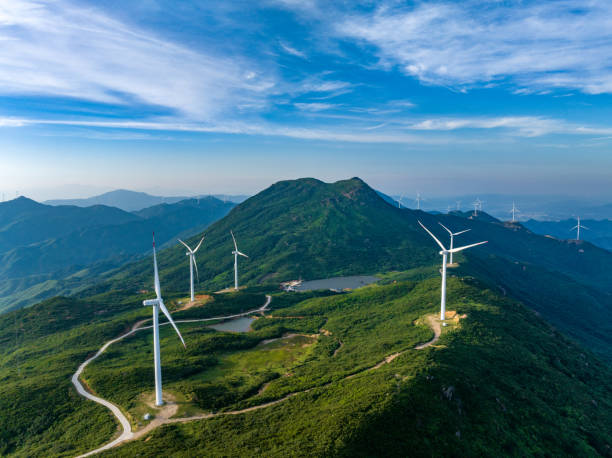 istock Wind farm on the mountain, blue sky and white clouds 1571322996