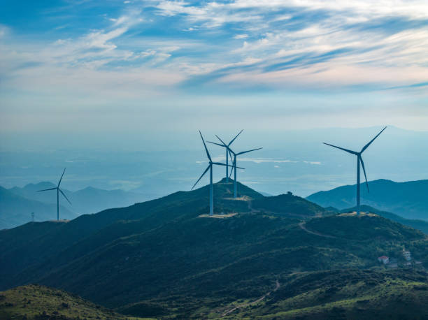 istock Wind farm on the mountain, blue sky and white clouds 1571323480
