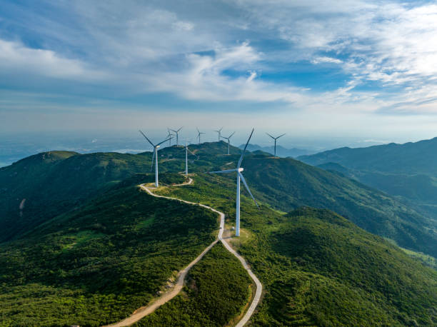 istock Wind farm on the mountain, blue sky and white clouds 1571323512