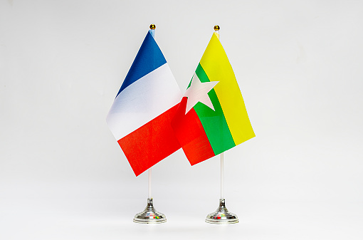 National flags of France and Myanmar on a light background. Flags.