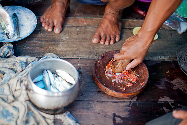 istock crushing chillies for spicy belachan 157134236