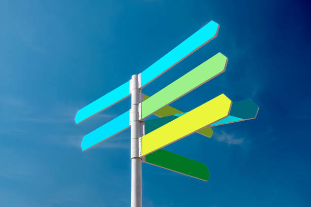 istock Multiple Blank Coloured Signs, Pointing In Various Directions 1571355629