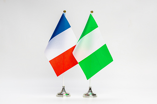 National flags of France and Nigeria on a light background. Flags.