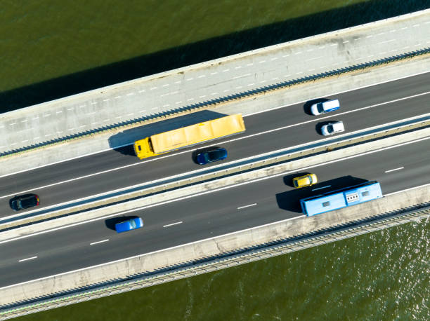 Ketelbrug overhead drone view with the A6 highway. The bridge is located between the Ketelmeer and Ijsselmeer in Flevoland, The Netherlands. Overhead drone shot with motion blur.
