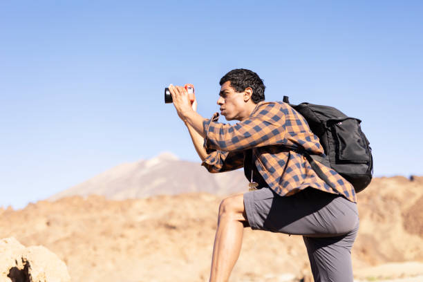 istock Man making memories on the mountain. 1571394673
