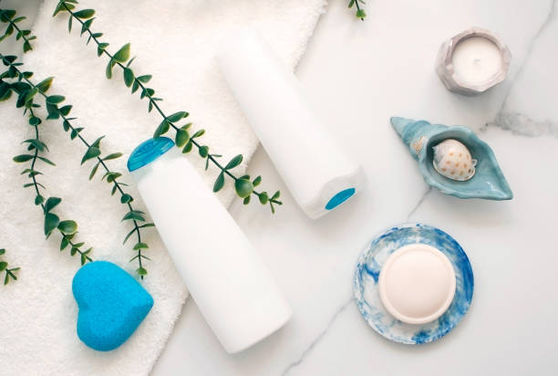 istock Top view of various cosmetic bottles and containers on white background. Empty plastic container for cosmetics for cream or shampoo. Concept of skin and hair car. 1571395218