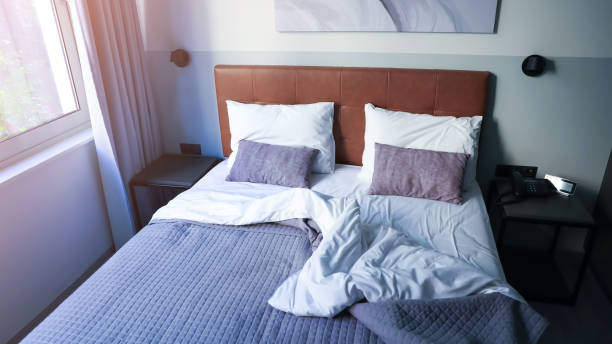 istock White cushion and white pillow as Modern bedroom interior with a stylish combination of trendy room interior image 1571403767