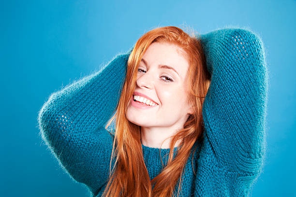 istock Cute female redhead wearing blue jumper 157141014
