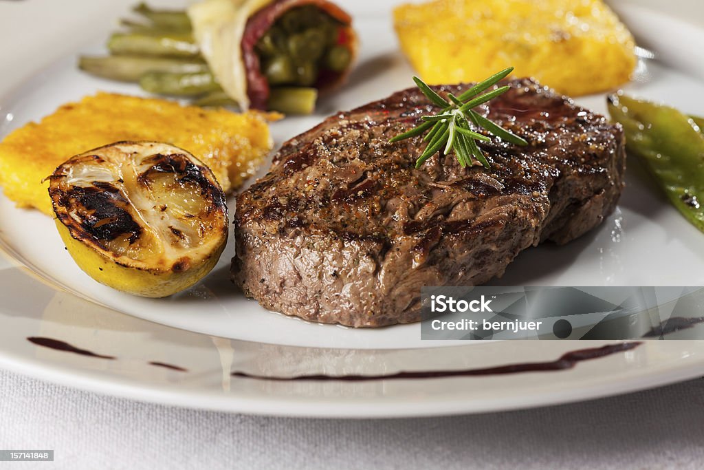 steak steak with a rosemary leaf Barbecue - Meal Stock Photo