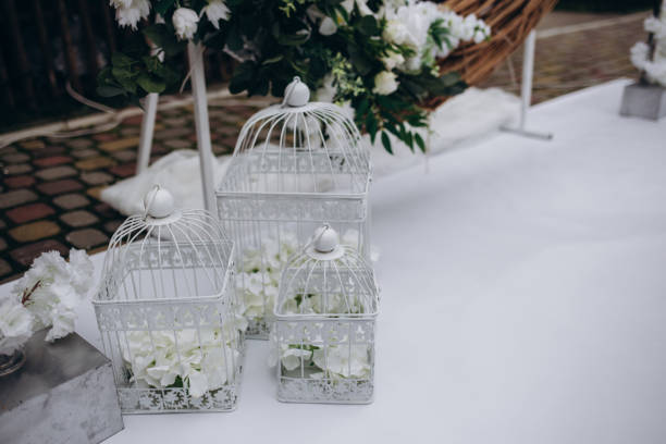 istock Wedding decor, candles in glass flasks in the forest. 1571441728