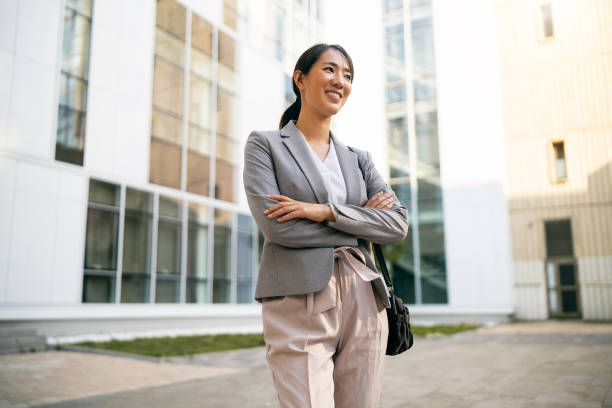 istock Businesswoman in financial district 1571457407