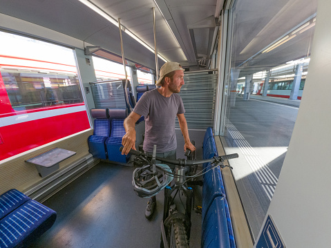Transporting a bicycle on a train