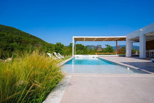 Swimming pool with lake and valley view