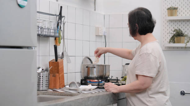 istock Asian senior women cooking 1571491813
